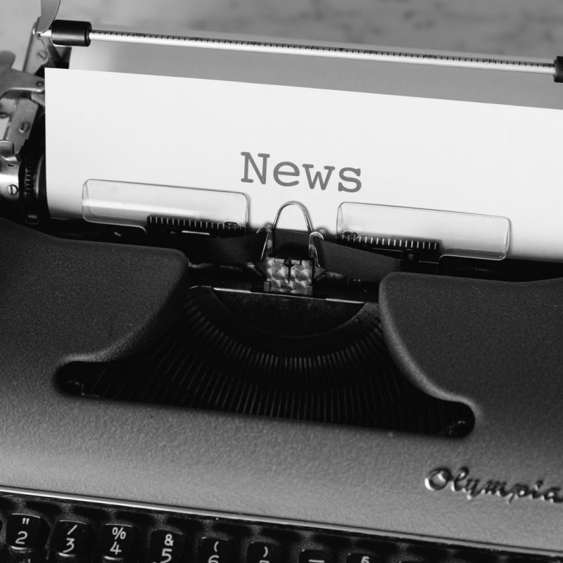 black and white typewriter on black table